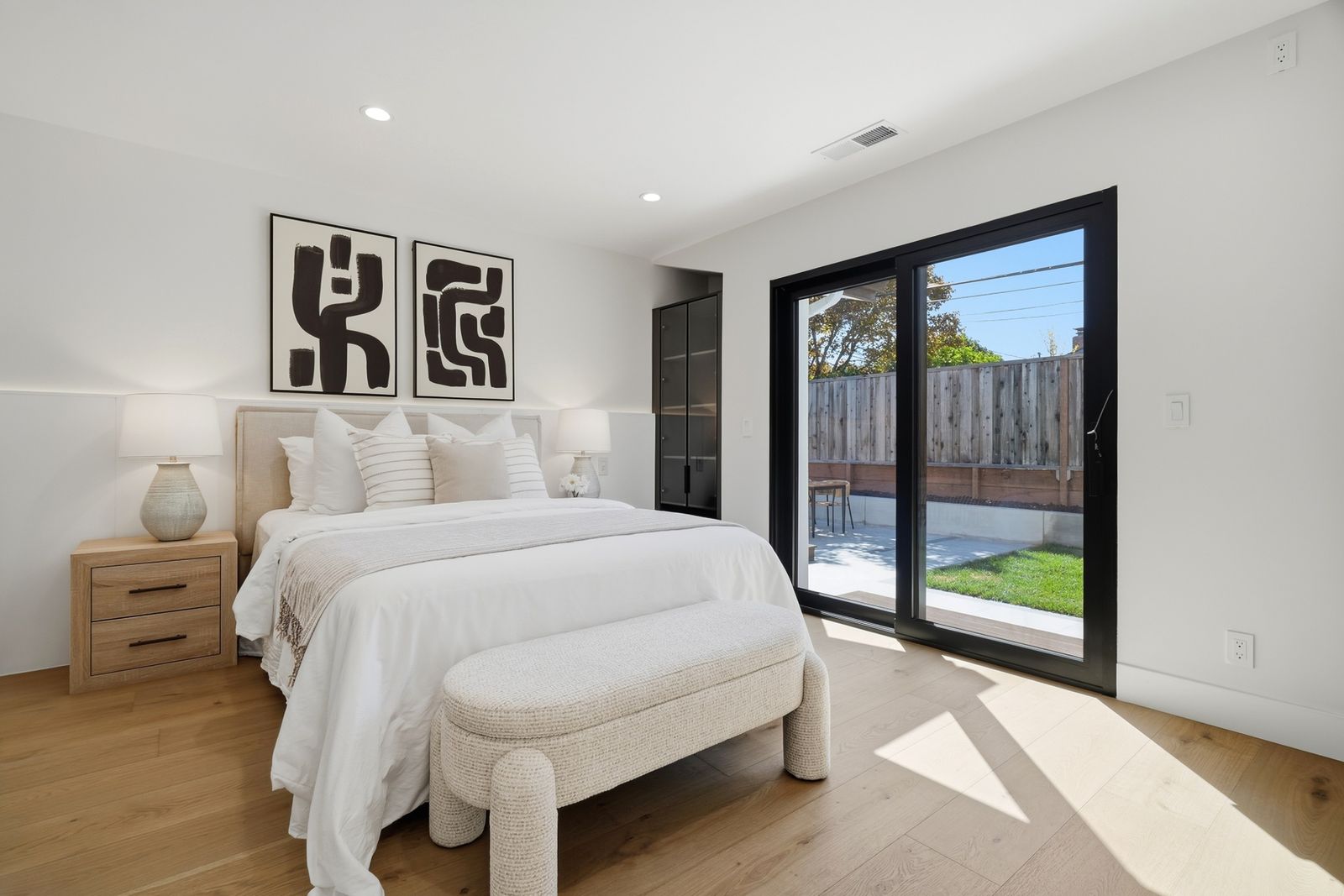 Bedroom with a sliding glass door to the backyard